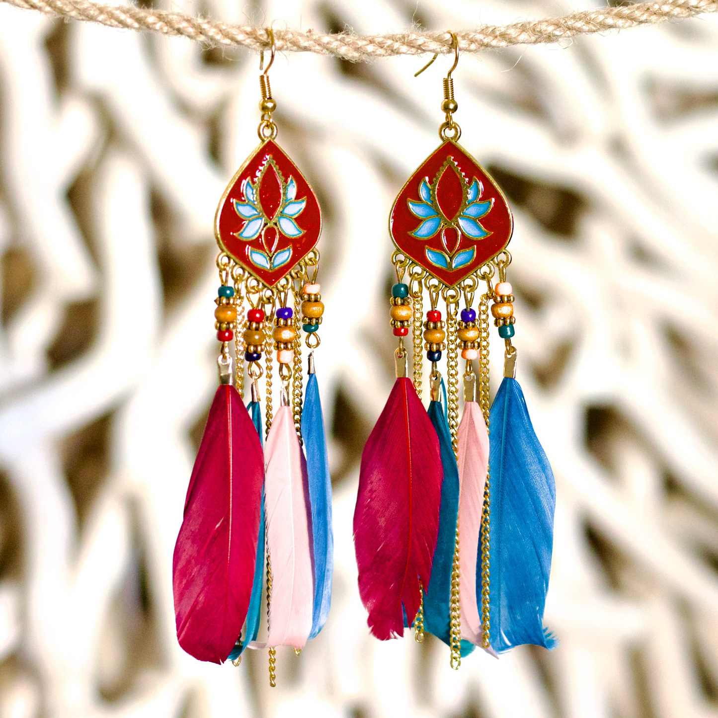 Bohemian-style statement coloured feather earrings