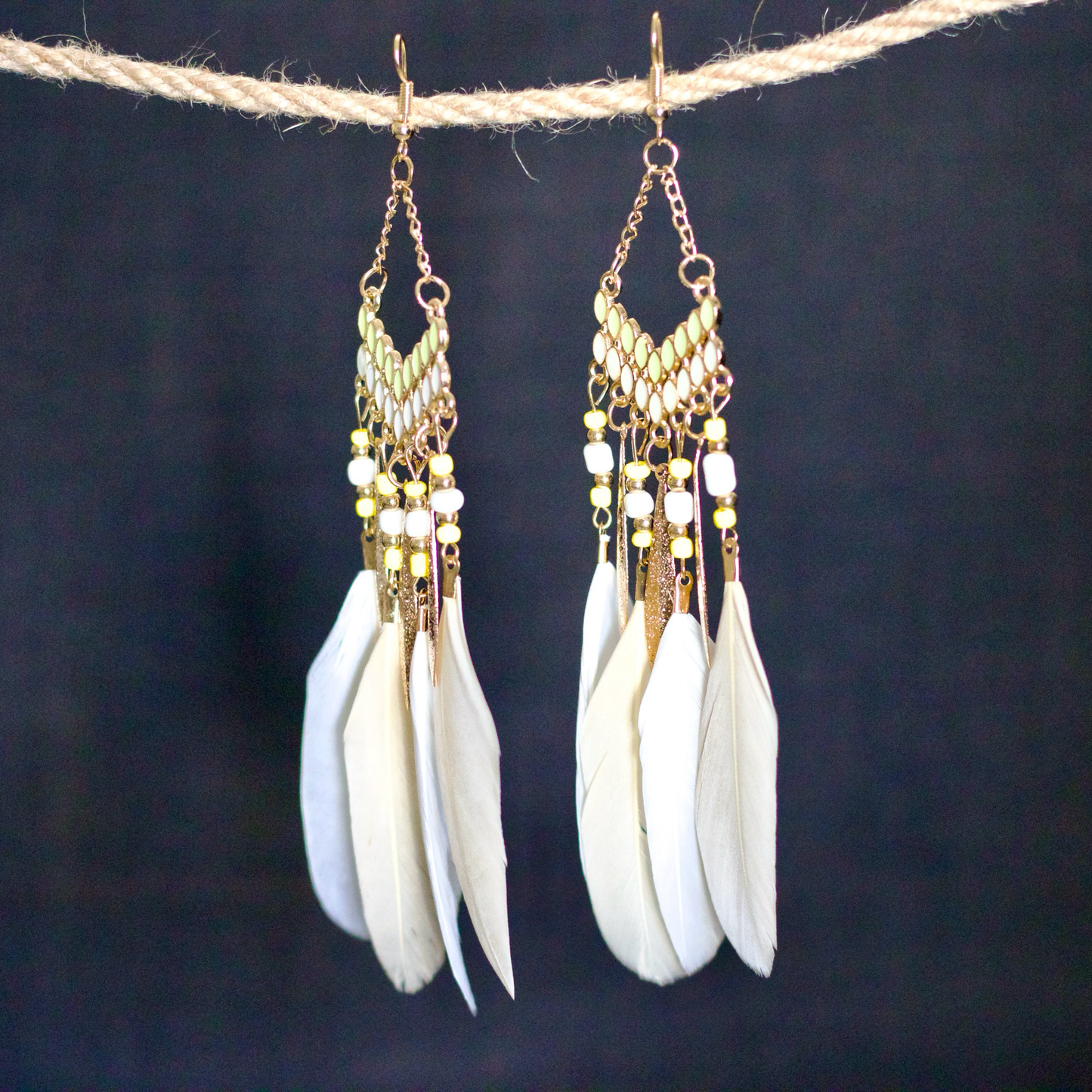 Bohemian-style statement white feather earrings