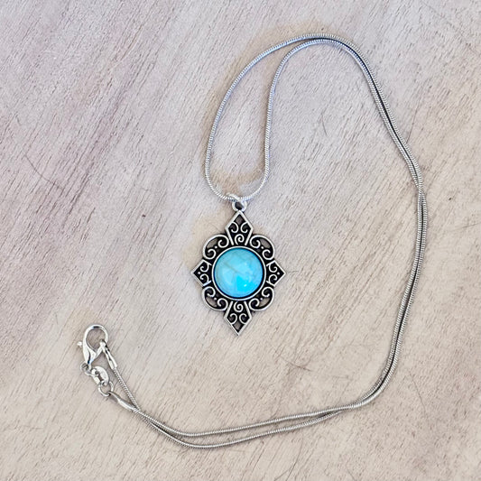 Celestial Cross Pendant – Ornate Silver & Sky Stone